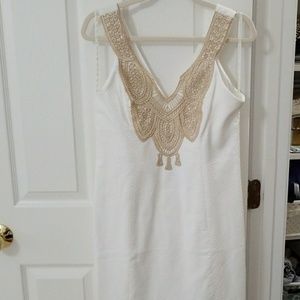 White tunic with gold stitching